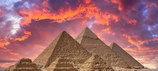 Foto op Canvas Sunrise at the Giza Pyramids, Egypt, with a Vibrant, Colorful Sky © Pixel Harmonics