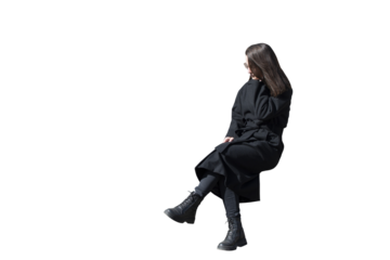 A woman in black coat in sitting pose isolated
