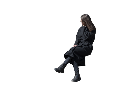 A woman in black coat in sitting pose isolated
