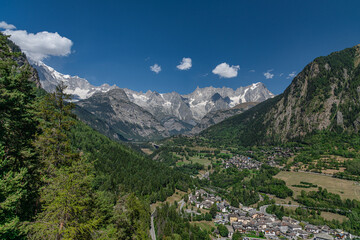 Fototapeta na wymiar Aerial view of a mountain village in Aosta Valley with scenic view of Mont Blanc chain