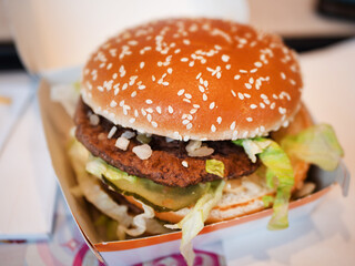 Classic Fast Food Double Burger with Sesame and Lettuce Close-Up