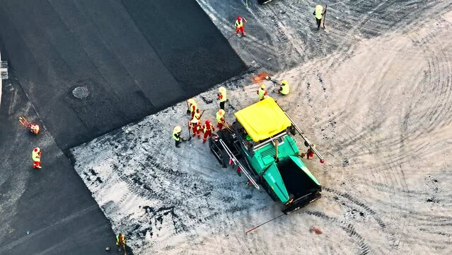 Aerial pan shot of road construction site scene