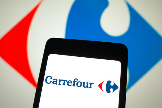 March 31, 2024, Brazil. In this photo illustration, the Carrefour logo is displayed on a smartphone screen and in the background.