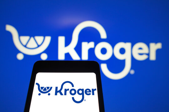 March 31, 2024, Brazil. In this photo illustration, the Kroger logo is displayed on a smartphone screen and in the background.