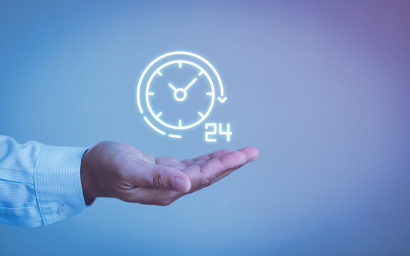 Nonstop client service support concept. Businessman hand holding virtual 24-7 with clock for worldwide nonstop and full-time available contact of service concept. customer service, business technology