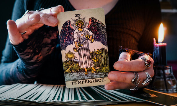 Malm&ouml;, Sweden - April 1, 2024: Temperance Major Arcana Tarot Card Rider Waite Smith. Spiritual altar, Divination tool, witchcraft, healing crystals, fortune telling cards, cartomancy.