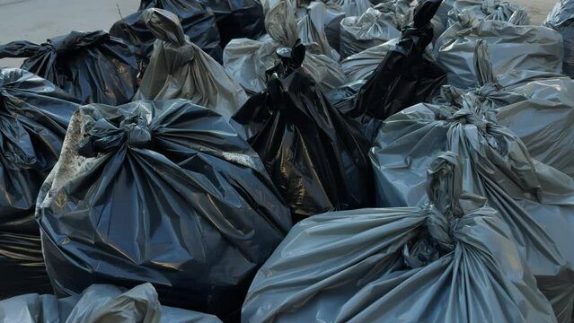 Urban blight: Piles of trash bags outside city building