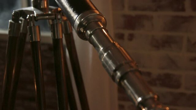 tilt down the barrel of a vintage telescope to eyepiece