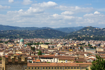 Florence's sprawling cityscape set against the serene Tuscan hills, highlighting the fusion of urban life and nature.