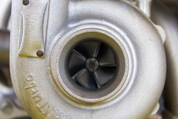Detailed view of a turbocharger with its intricate blades, exemplifying the precision engineering...