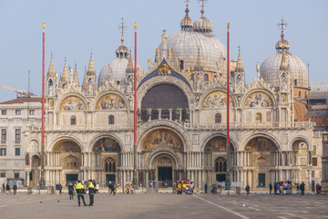 Fototapeta na wymiar Basilica San Marco with the policeman in front, Venice, Veneto, Italy