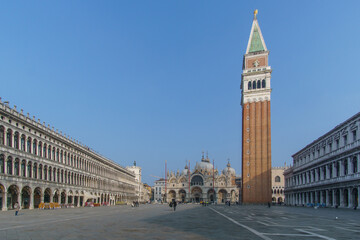 Almost empty San Marco square with Basilica and Tower on a sunny winter day, Venice, Veneto, Italy - obrazy, fototapety, plakaty