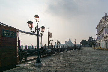 Street lamp at promenade near Doge Palace at San Marco place on a sunny winter day, Venice, Veneto,...