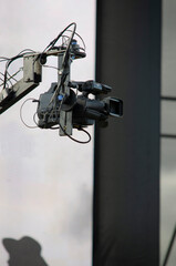 professional video camera on a crane covering an outdoor event