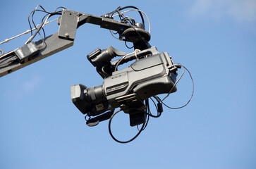 professional video camera, filmer on live stage on boom crane