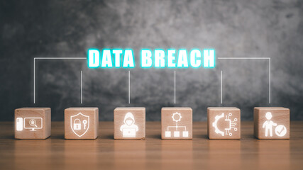 Data breach concept, Wooden block on desk with data breach icon on virtual screen.