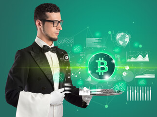 Handsome young waiter in tuxedo holding currency icons on tray