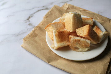 Sliced Toast bread white plate on vintage background.. Continental Breakfast concept. 