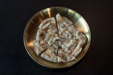 Top view of tawa chapati on plate.