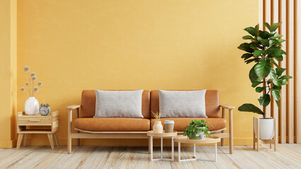 Living room wall mockup with leather sofa and decor on yellow wall background