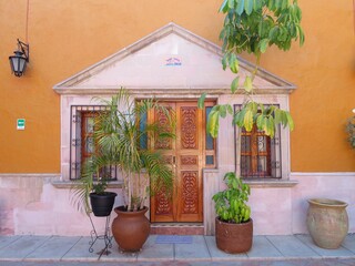 traditional colonial mexican house with flowers