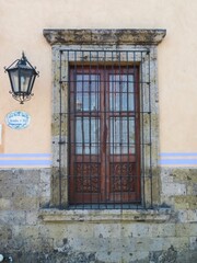 old colonial window in a wall, Mexico, Tlaquepaque