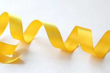 Bright yellow ribbon curling freely, sunny and cheerful against white  optimism and joy