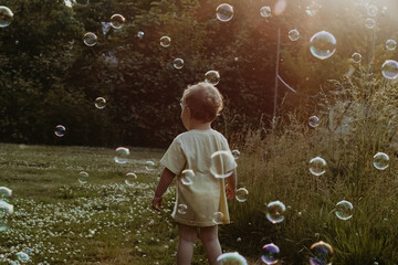 Running through the bubbles on a sunny day