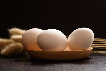 Fresh white organic eggs of the Leghorn breed from local farms raised in an open system. Ingredients for cooking healthy food - obrazy, fototapety, plakaty