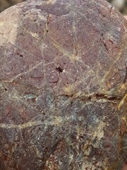 abstract Textured background with round pebble stones. Vacation holiday recreation on beach concept. High quality photo. Fragment with a texture of rock. surface  stone wall with cracks.