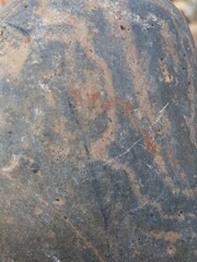 abstract Textured background with round pebble stones. Vacation holiday recreation on beach concept. High quality photo. Fragment with a texture of rock. surface  stone wall with cracks.