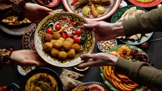 Eid holiday. Muslim family cooking, eating, praying and celebrating together