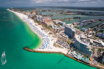Florida beaches. Clearwater Beach Florida. Panorama of city. Spring or summer vacations. Beautiful view on Hotels and Resorts on Island. Blue color of Ocean water. American Coast. Shore Gulf of Mexico