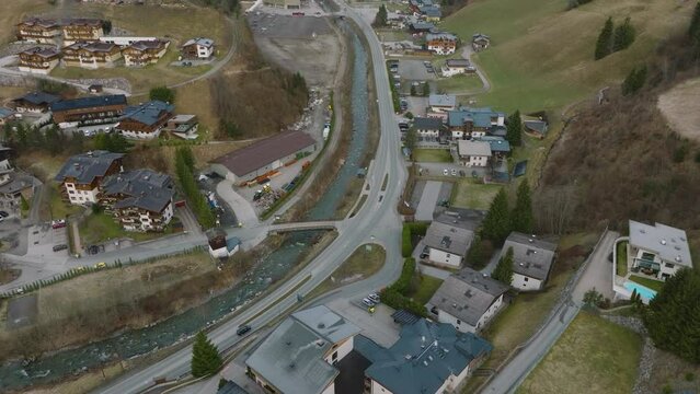 Saalbach-Hinterglemm ski resort in Austria, with winding roads and chalets, aerial view