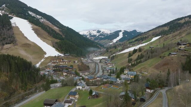 Saalbach-Hinterglemm ski resort in Austria with snowy slopes, morning light, aerial view