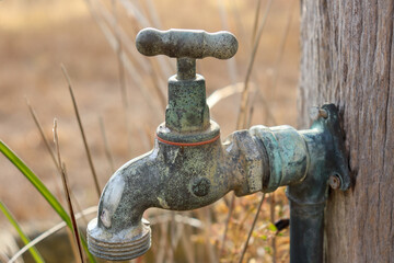 old water tap in field