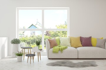 White living room with sofa and summer landscape in window. Scandinavian interior design. 3D illustration