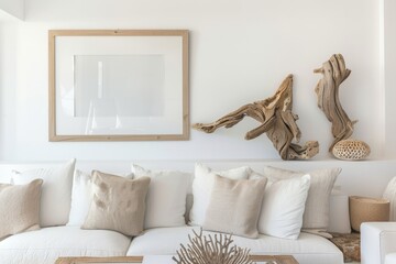 Living room with white couch, wooden sculptures on wall