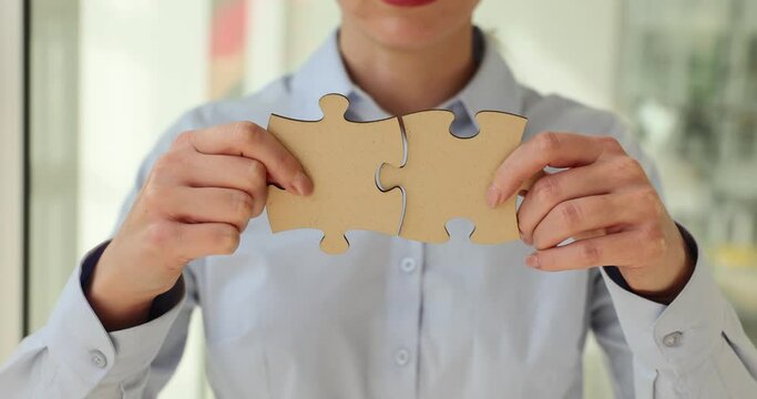 Putting the last pieces of puzzle together in women hands. Find a business solution and action