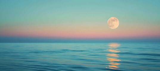 Full moon over blue sea water in pastel sky
