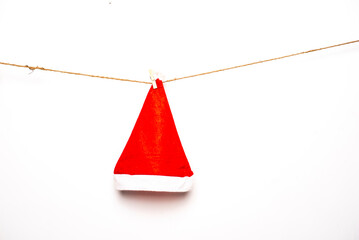 Santa hat is hanging on isolated white background.