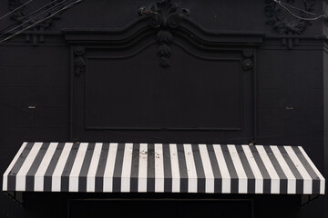 awning on piano keys on black background
