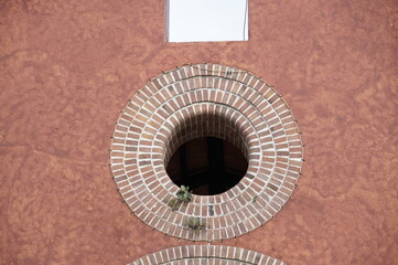 wall with window circle brick church