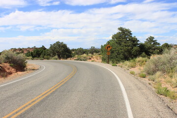 Road in Canyonlands National Park with wrong turned sign