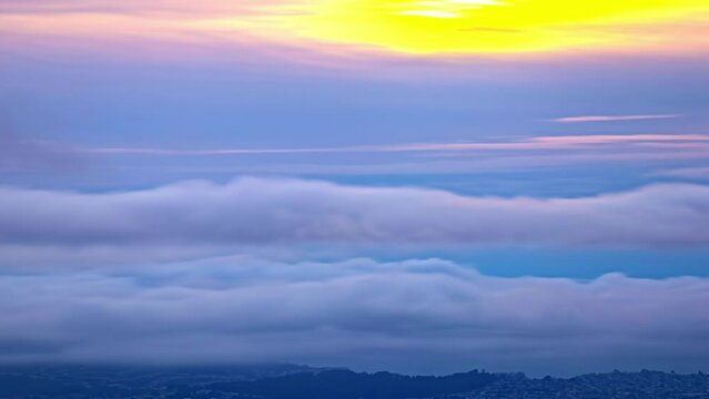Dreamy cloud timelapse with golden sun behing them