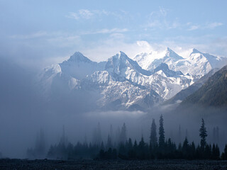 Snow-capped mountains in the morning mist