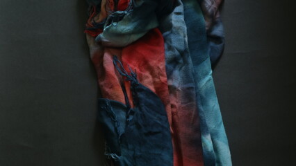 Abstract colorful fabric with black background, copy space