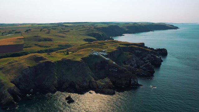 Discover Scotland&rsquo;s Coast: Aerial Perspectives of Rocky Shoreline of St Abbs Head and Lighthouse on British Coast in Remote Scottish Borders