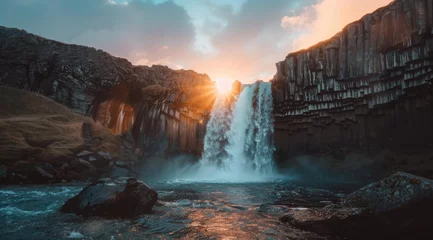 Foto op Aluminium A stunning landscape photograph of the breathtaking waterfall at Sunset in Iceland © Kien
