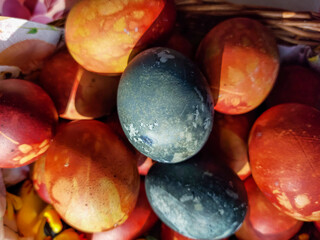Naturally Dyed Easter Eggs, decorated with plants and flowers boiled with red cabbage, onion peels, hibiscus tea creating different colors.